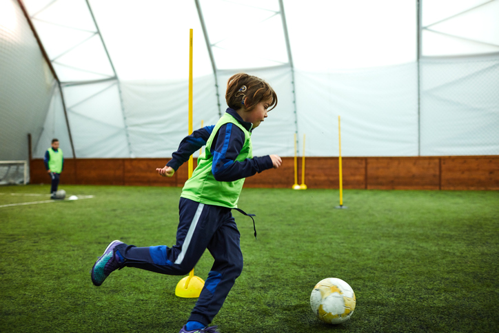 Kid with Cochlear Implant Playing Soccer